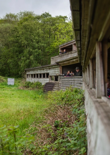 People in a large bird watching hide.
