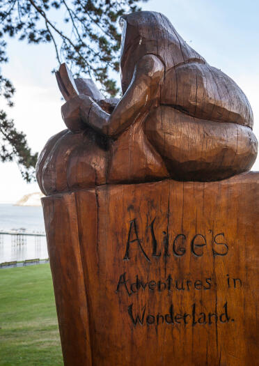 Image of a carved wooden figure from Alice in Wonderland.