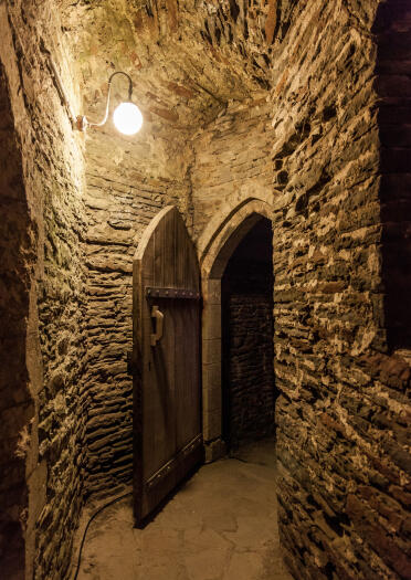 Inside Caerphilly Castle showing old brickwork and doorway.