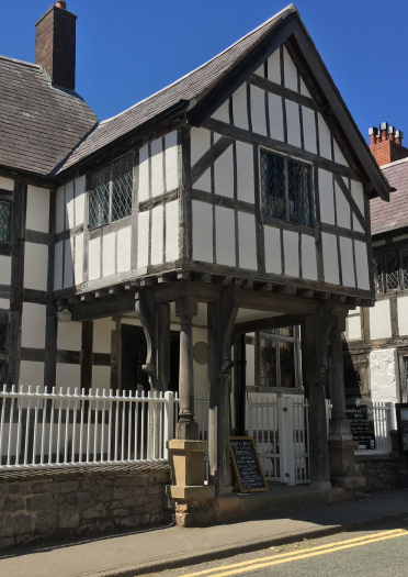 Front of Nantclwyd Y Dre - a black and white timbered town house.