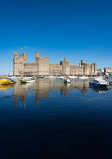 A harbour and castle on a beautiful blue sky day.