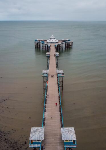 An aerial shot of a long pier.