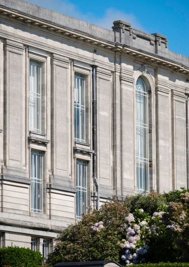 The facade of a stone library building.
