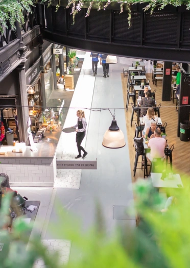 Retail units and eating area in a refurbished market.