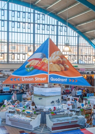 Aerial shot of an indoor market.