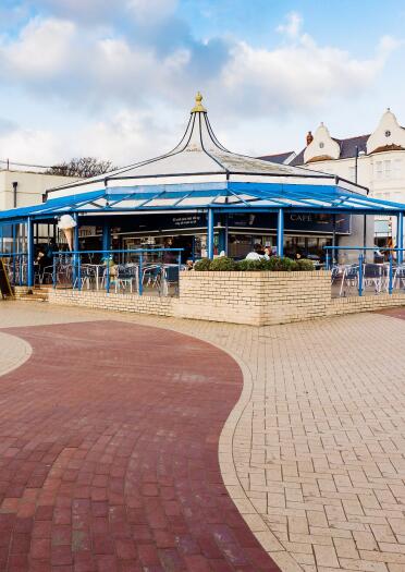 A café on the promenade of a seafront.