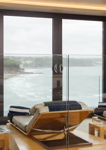 Loungers in a spa overlooking the coast.