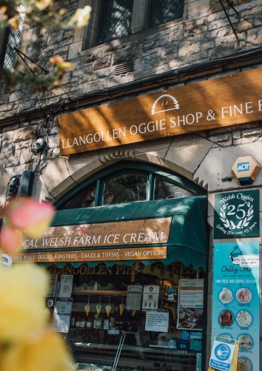 External shot of an artisan food shop in a town centre.