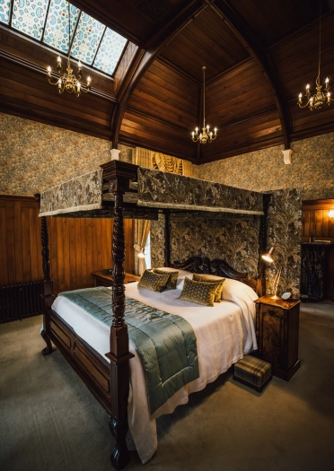 A four poster bed in a grand hotel.