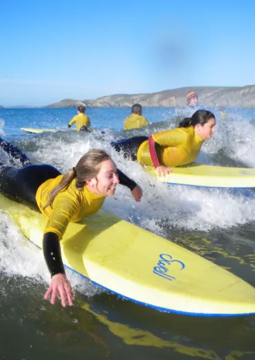 People surfing in the sea.