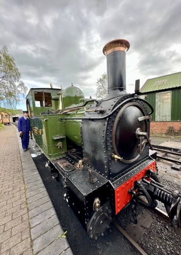 A steam train at a station