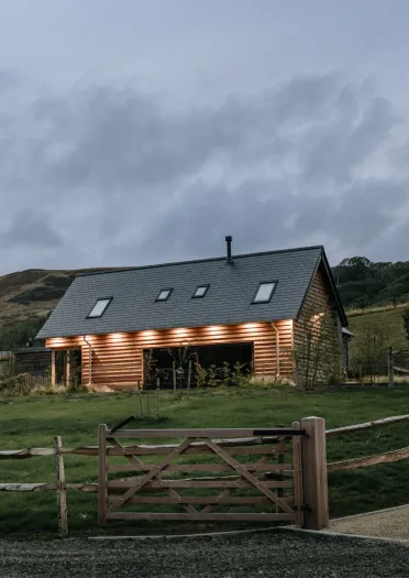 A renovated hay barn in a field for accommodated guests.