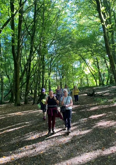 Women walking in a forest.