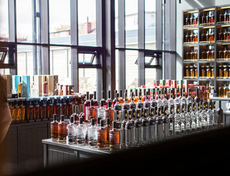Bottles of whisky on display in a shop.