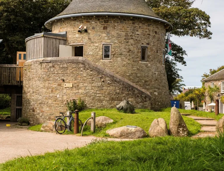 Exterior view of a stone built conical shaped tower.