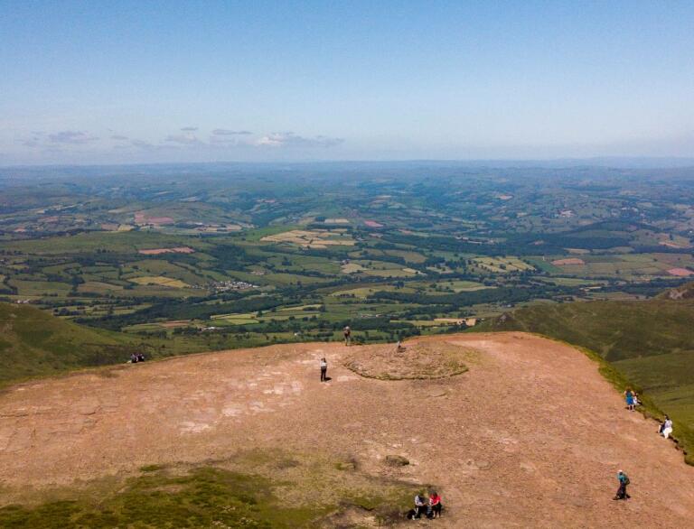 Spectacular view of the green pastures below from the summit of Pen y Fan, Brecon Beacons.