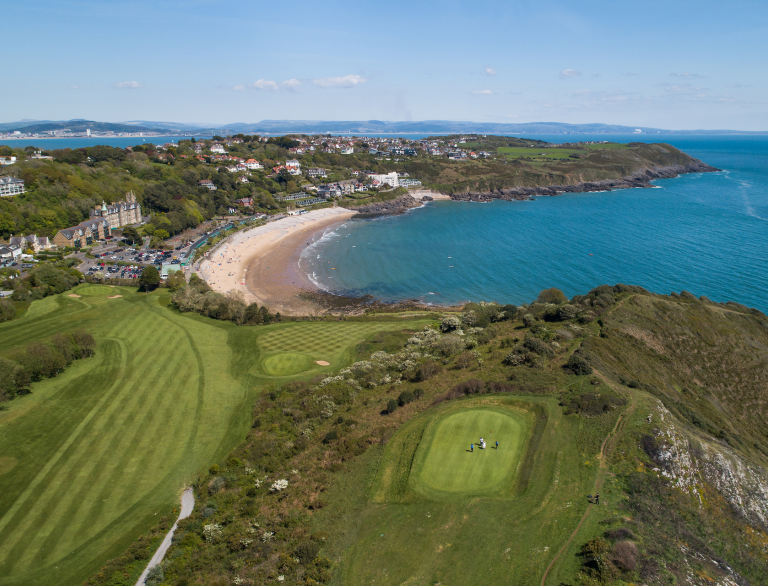Sweeping aerial views of the coast at Langland Bay Golf Club.
