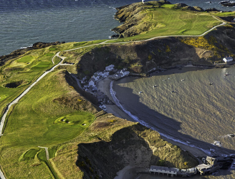 Aerial view of Nefyn Golf Club with the sea on both sides of the headland.