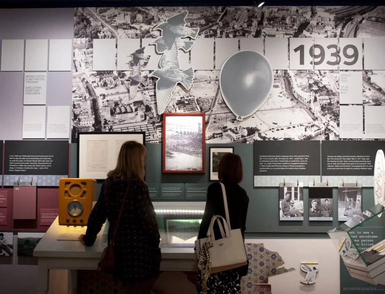 two females looking at display in museum.