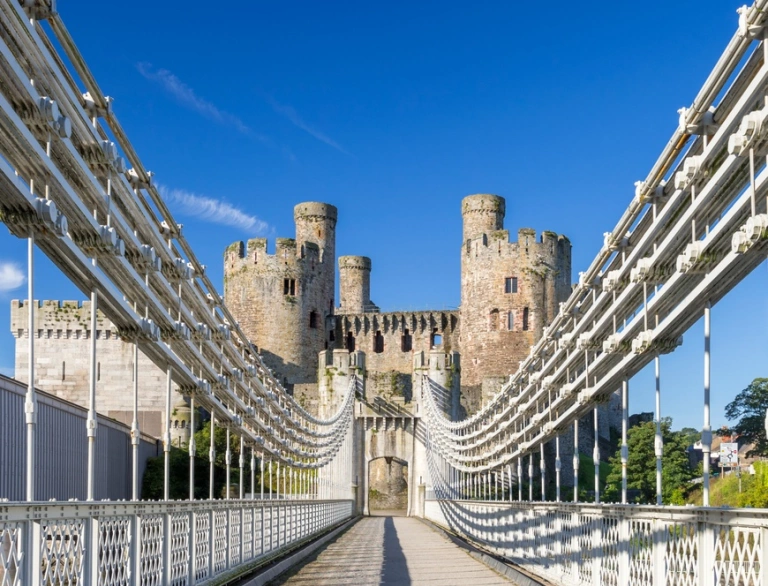 The iron drawbridge walkway leading to a castle.