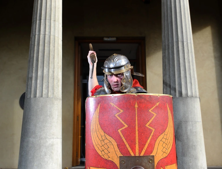 A Roman soldier with a shield and spear.