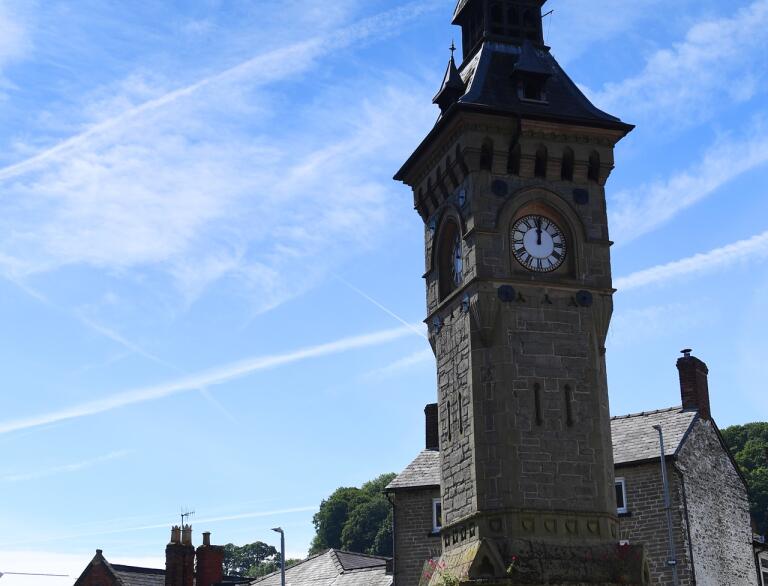 A clock tower and museum in a town centre.
