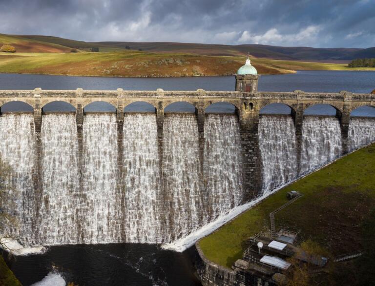 A dam overflowing with water.