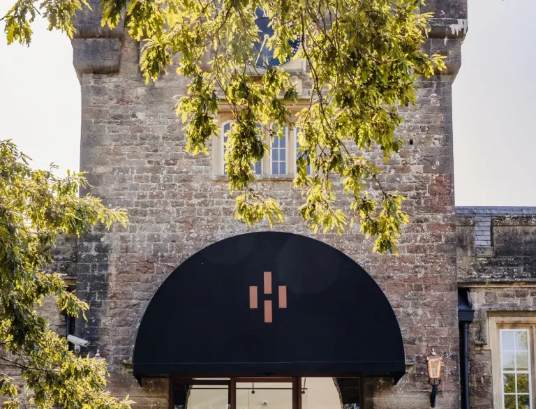 External shot of castle tower at a gin distillery.