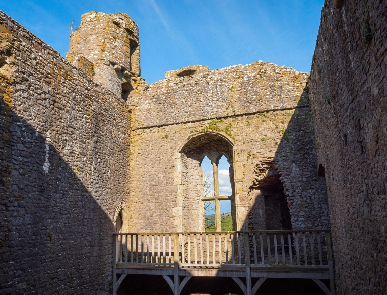 Inside the courtyard of a castle with views from the castle window.