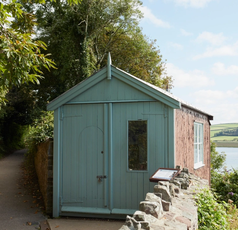 A writing shed looking out over an estuary.