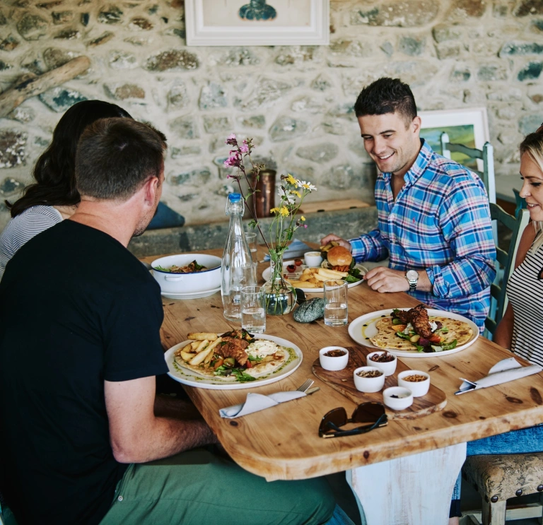 Group of people dining at a restaurant.