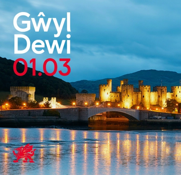 A castle lit up at dusk.