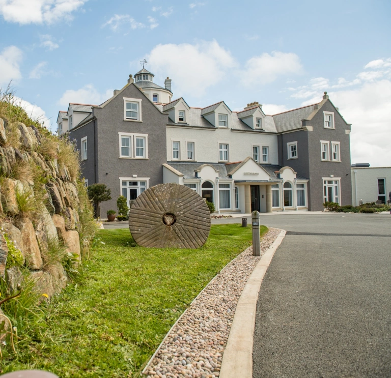 A driveway leading toward a hotel.
