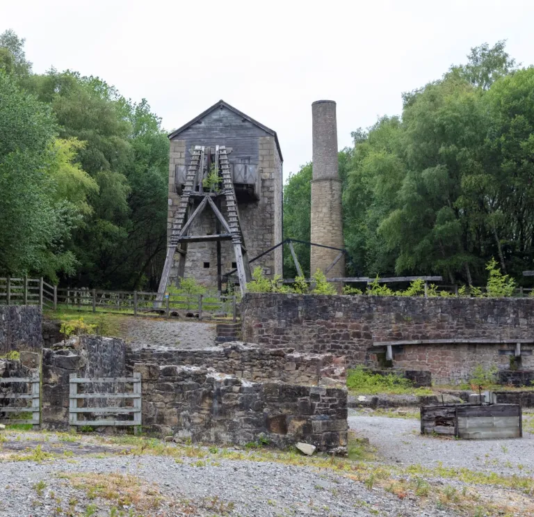 Winding wheel tower and chimney stack at a lead mine.