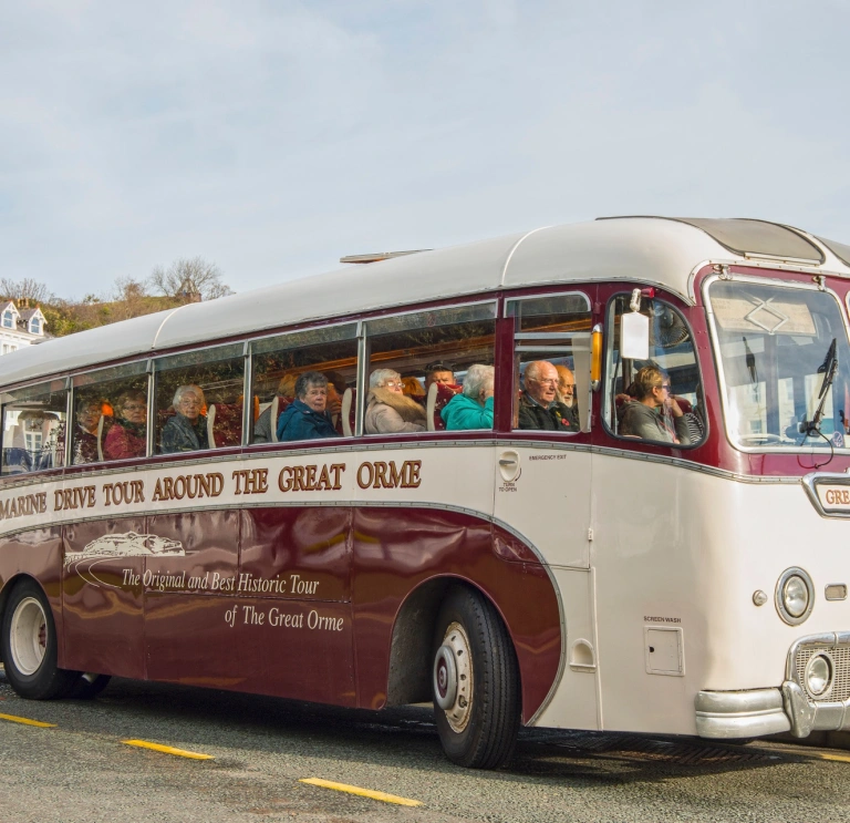 People on a vintage coach tour