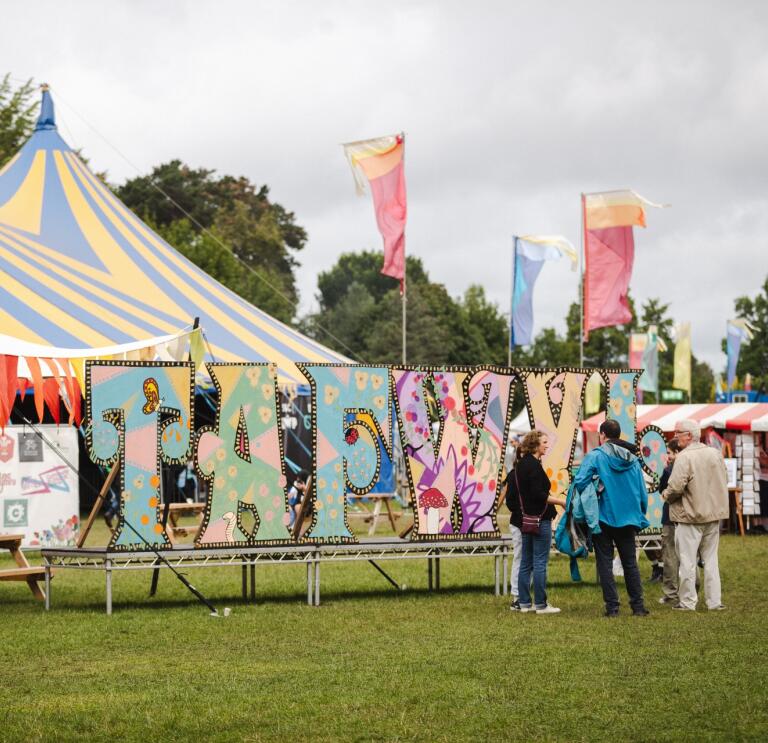 Tafwyl sign and performing tent at the festival.