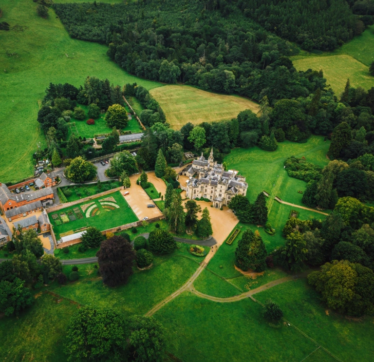 Aerial shot of luxury grand hotel and its grounds.