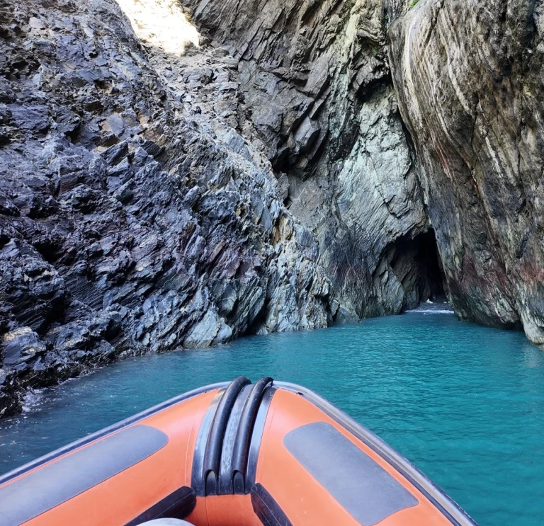 A boat entering a cave.