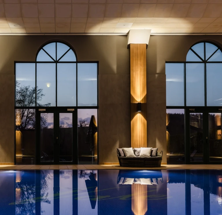 A pool and loungers at a hotel health club.