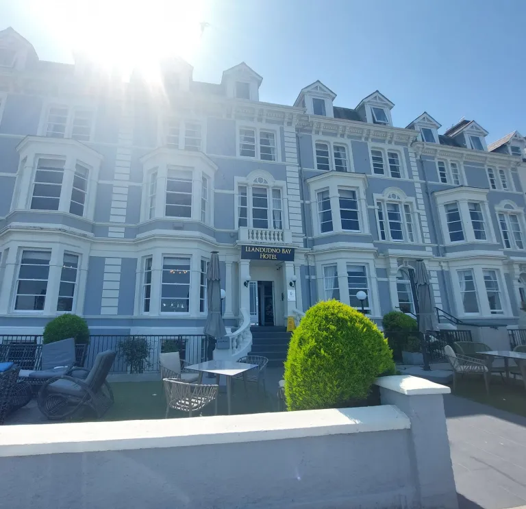A hotel bathed in glorious sunshine on the seafront.