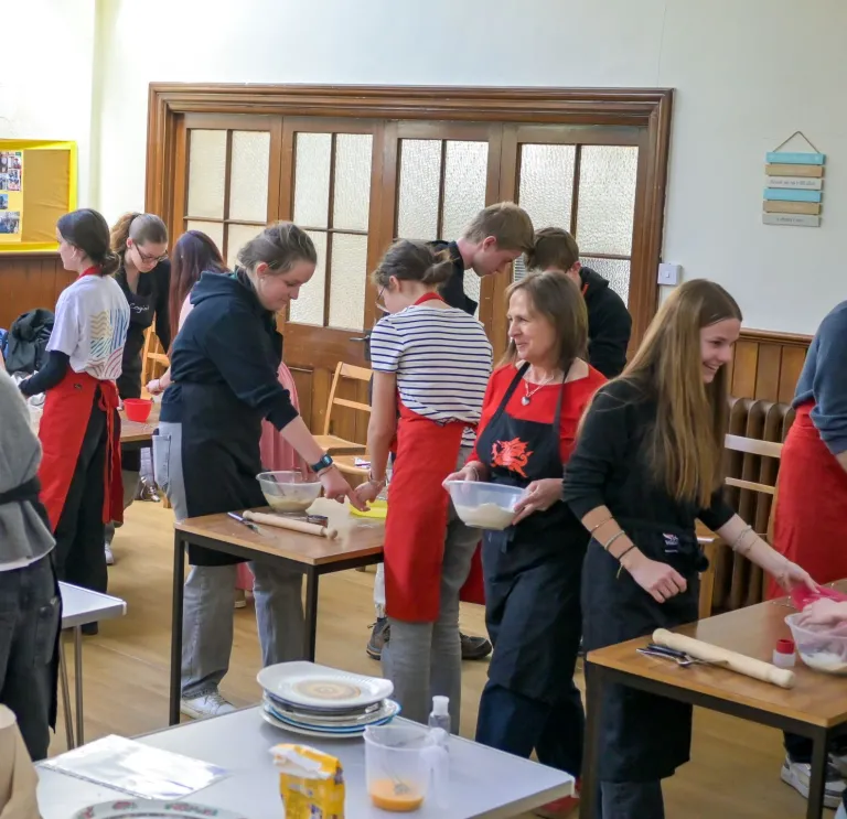 Group of ladies making welshcakes in a workshop.