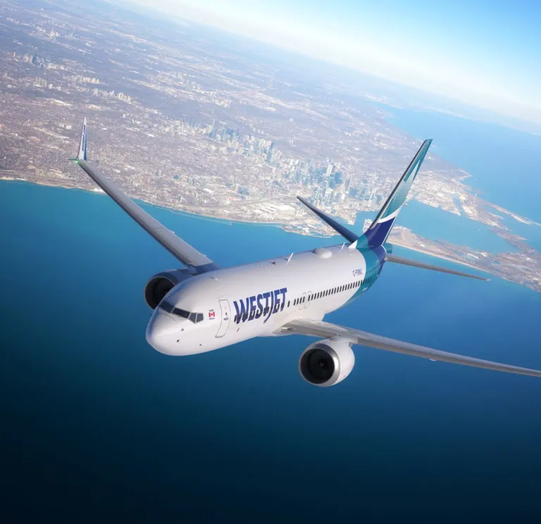 An aircraft in the sky above the sea