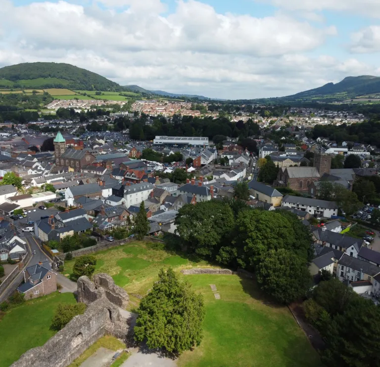 Aerial shot of a market town and its castle.