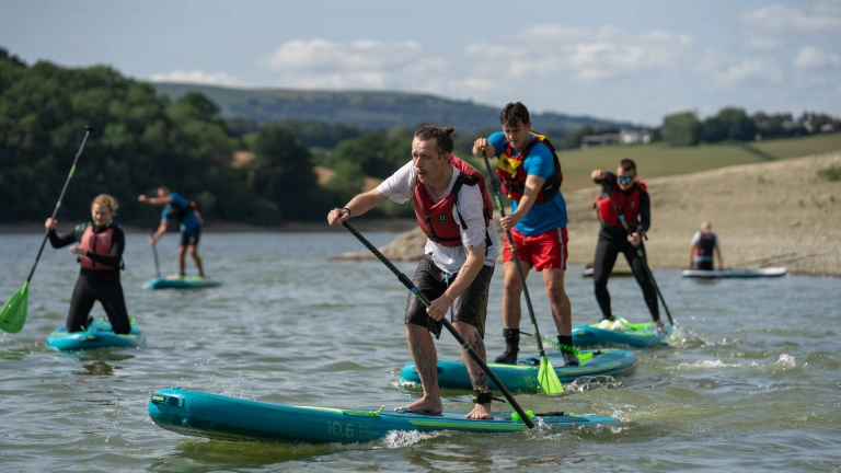 Stand up paddleboarders on the water.