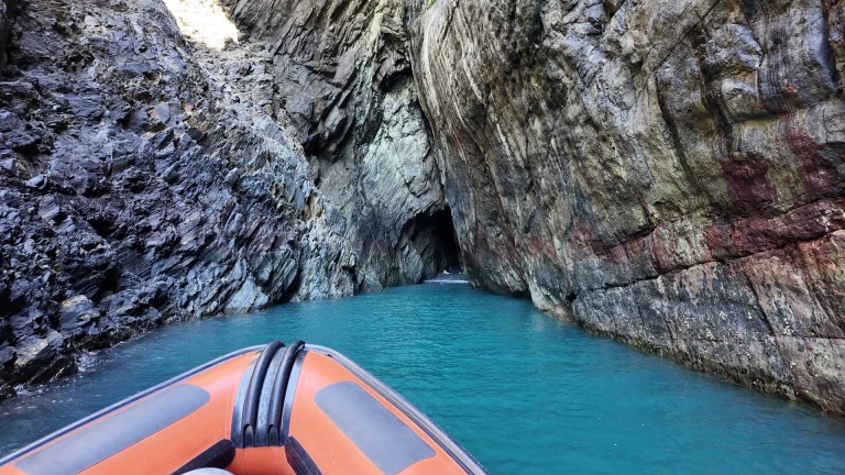 A boat entering a cave.