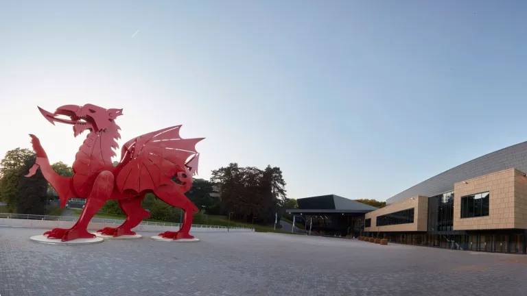 ICC Wales exterior with a large red dragon close up.