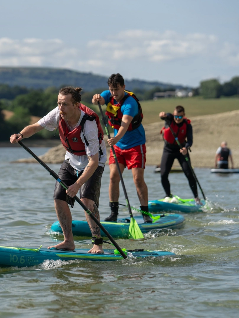 Stand up paddleboarders on the water.