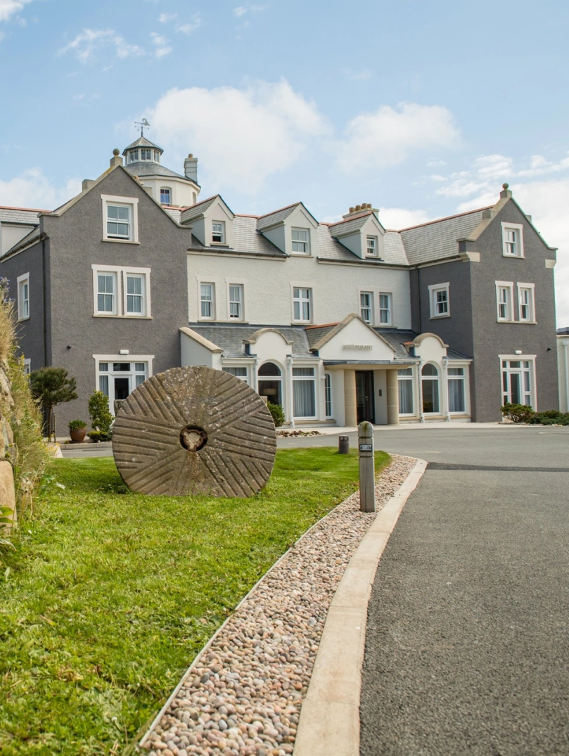 A driveway leading toward a hotel.