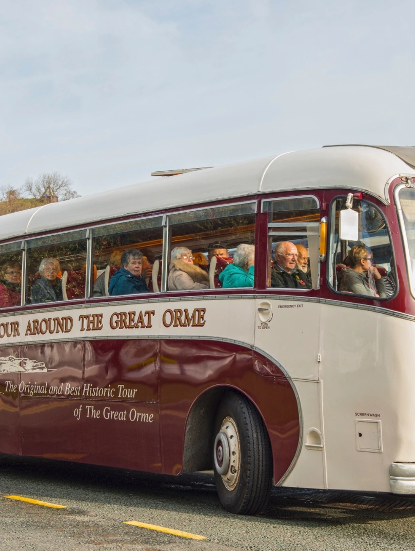 People on a vintage coach tour