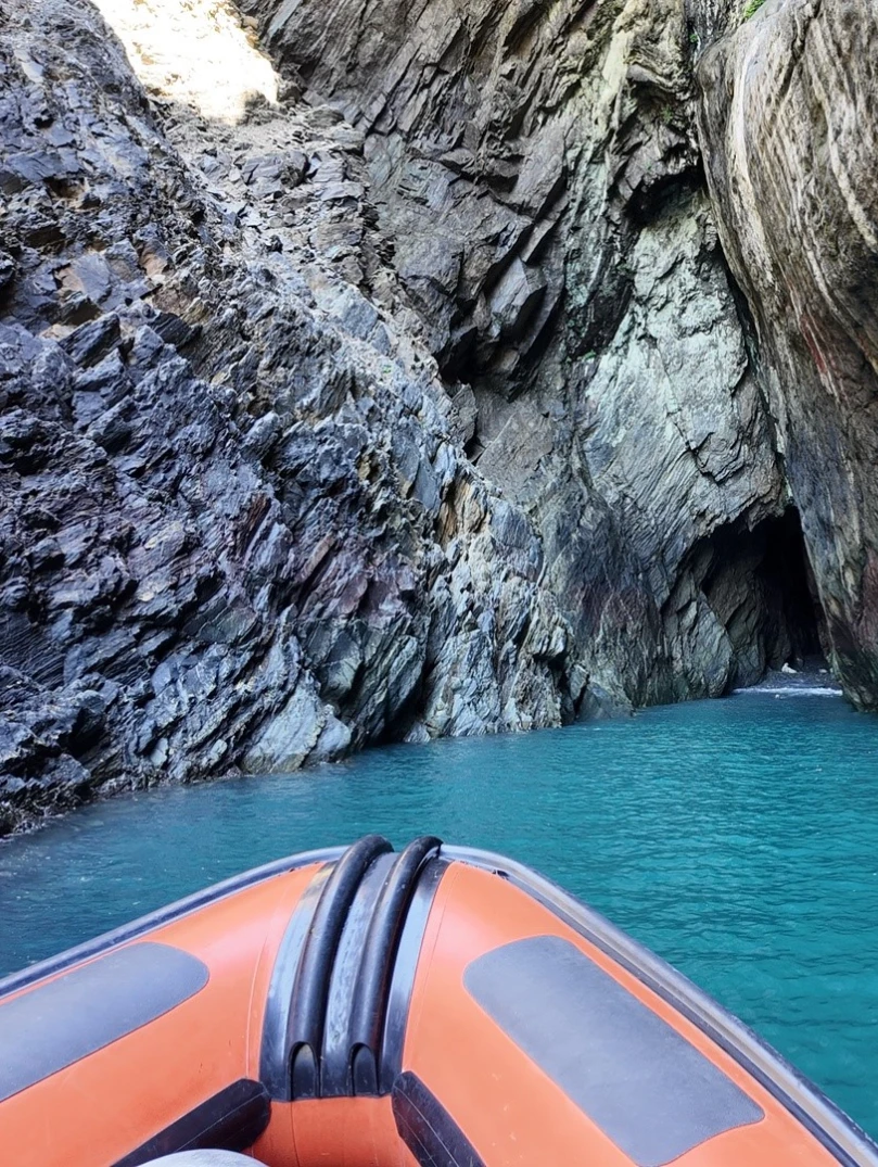 A boat entering a cave.